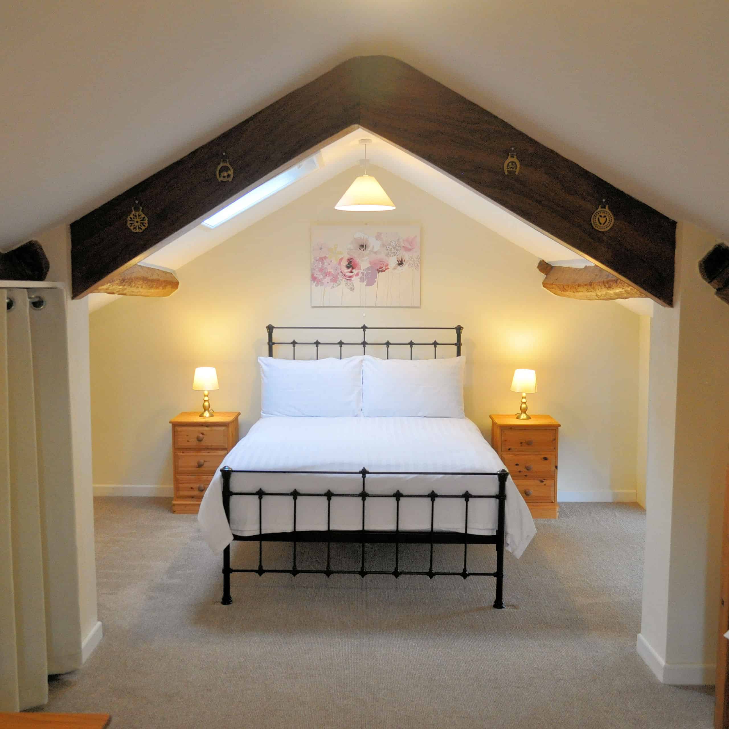 FIrst floor Wye Cottage showing iron double bedstead.